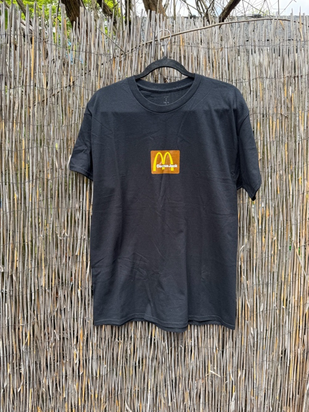 Cactus Jack by Travis Scott Black Tee with Yellow & Orange Logo Patch